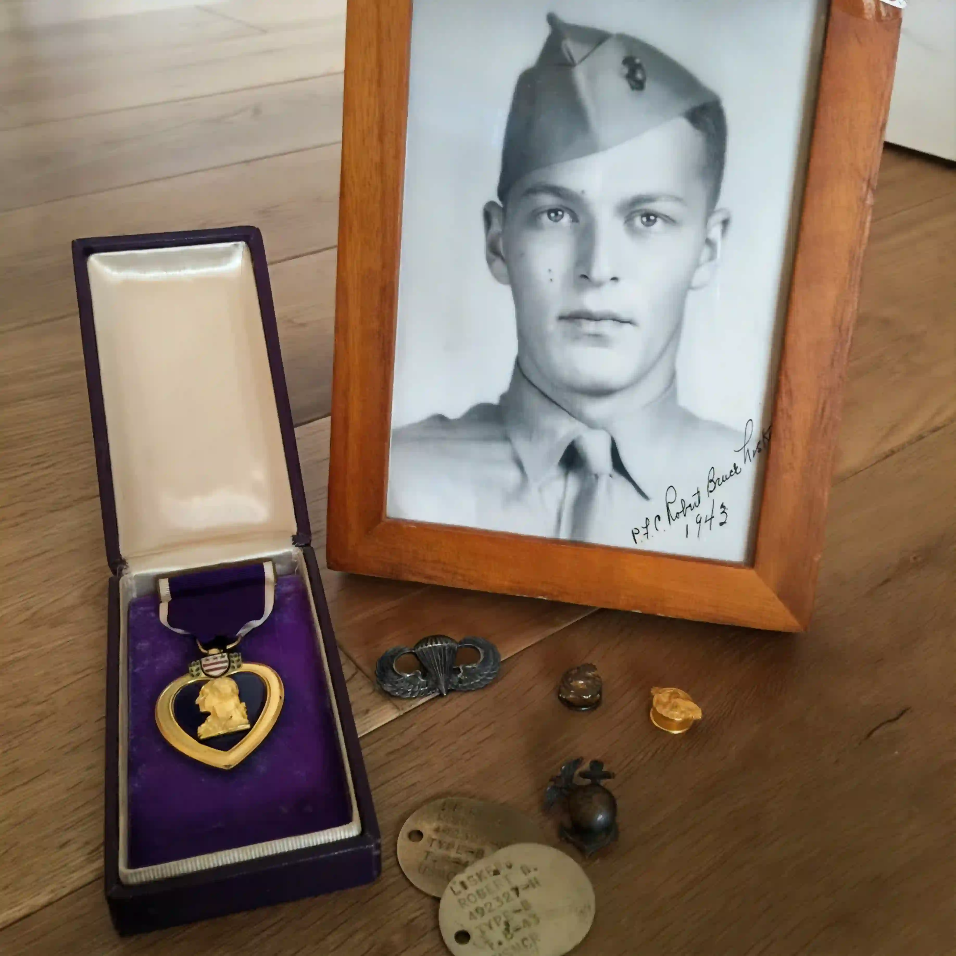 Pfc Robert Bruce Lisker's framed Marine Corps photograph displayed together with his medals, in Bruce Lisker's home today