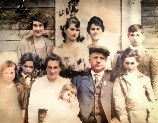 Mom (Dorka; Czechoslovakian for Dorothy) is the youngest kid in this photo, sitting on her mother Mary's lap. The entire Zeman family is here, probably on the stoop of their austere Havre, Montana home. (Original photo B&W, restored and colorized in Photoshop) - 1917