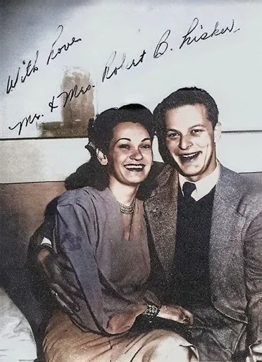 A signed photo of Mom (29) and Dad (19) shot in Tijuana, Mexico moments after their wedding, as a way to announce their nuptials to one and all. (Original photo B&W, restored and colorized in Photoshop. Credit unknown, from Ancestry.com) - Jan 1, 1946