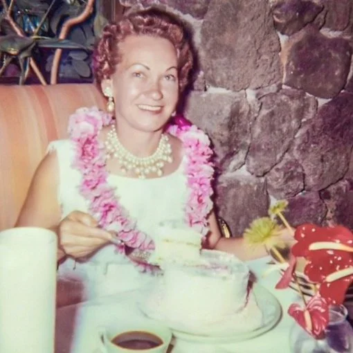 Mom cutting into her 46th birthday cake, on vacation in Hawaii - 1962