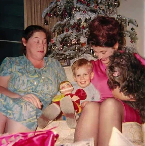 My aunts, Roxy and Sheila, and me with Tommy Trojan and Dobie the dog. Christmastime at the Huston Street house - 1967-ish.