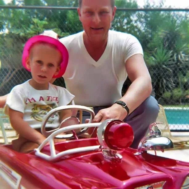 Dad and me with my cool Fire Dept car on the back patio of the Huston Street house - 1968.