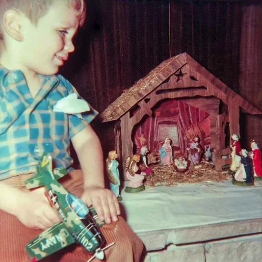 With our family nativity set, assembled each year on the flagstone hearth of our living room fireplace at Huston Street - 1969.