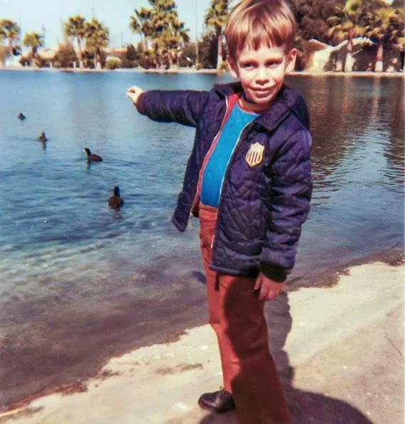 Pointing at some ducks fleeing into the lake at Reseda Park, Reseda, CA - March 1970