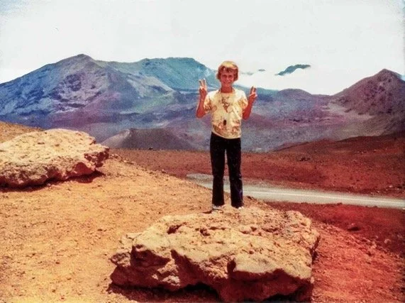 Throwin' them peace signs whilst sporting a bold motocross shirt, vacationing in Hawaii - 1973