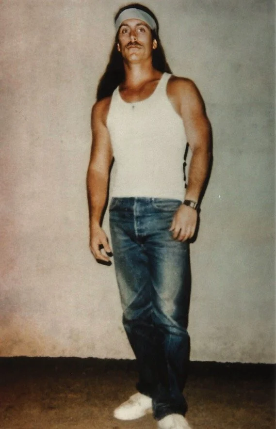 A polaroid taken on C-Yard, Mule Creek State Prison. Lifting weights helped me pass the endless time—and project a tougher facade, making life a bit safer - 1991.
