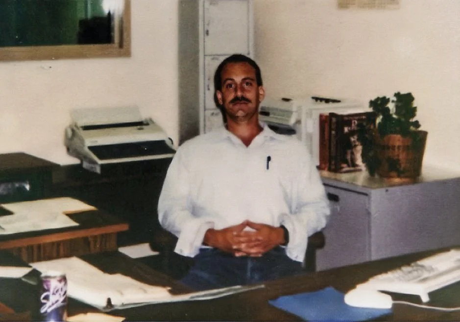 Behind my clerk's desk in C-Facility's Education Department at Mule Creek State Prison. Depressing as it looks, this was one of the better prison jobs, and it allowed me to work on my case after I'd completed my daily clerical tasks - 1995.